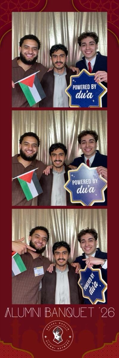 Guests at a photo booth during a corporate event in a hotel ballroom
