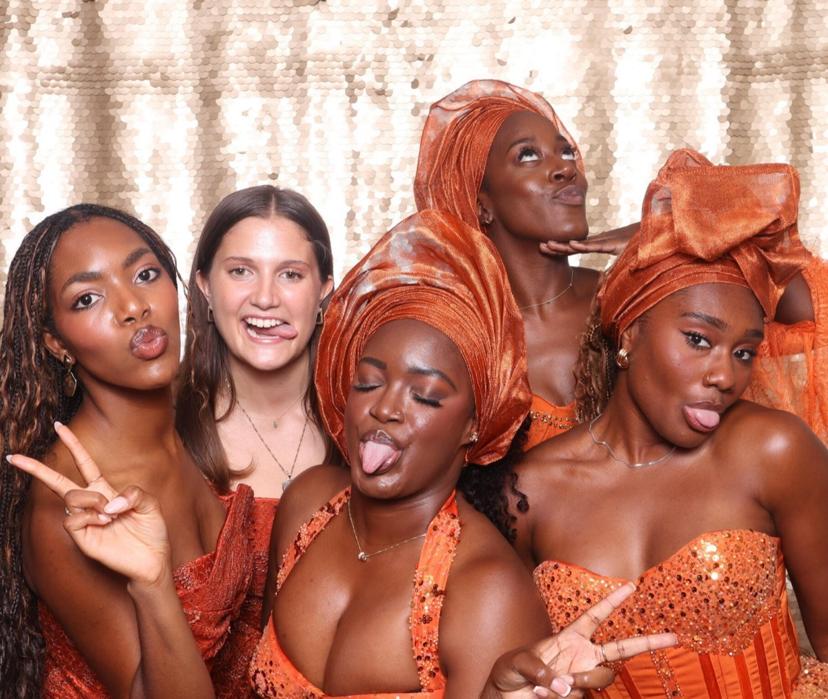 Guests in traditional attire celebrating at a Philadelphia photo booth