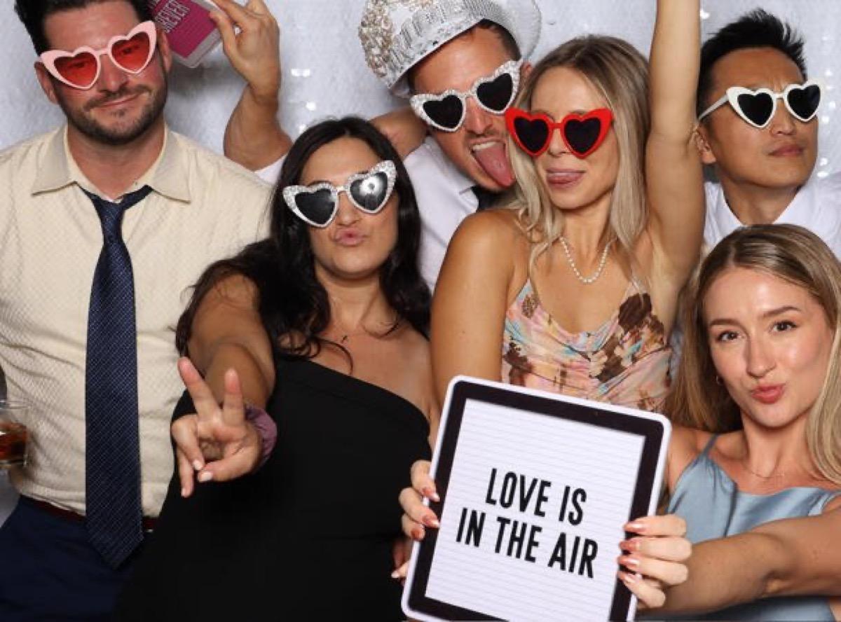 Wedding guests enjoying a photo booth rental at a Philadelphia reception